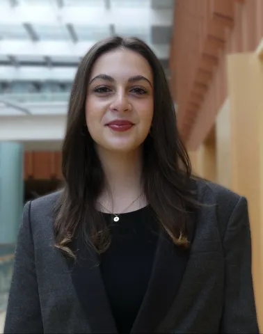woman standing with a blazer