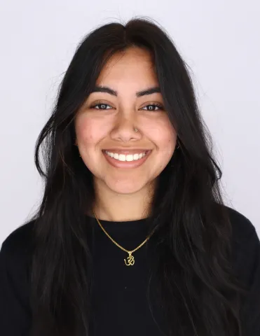 Woman smiling in black